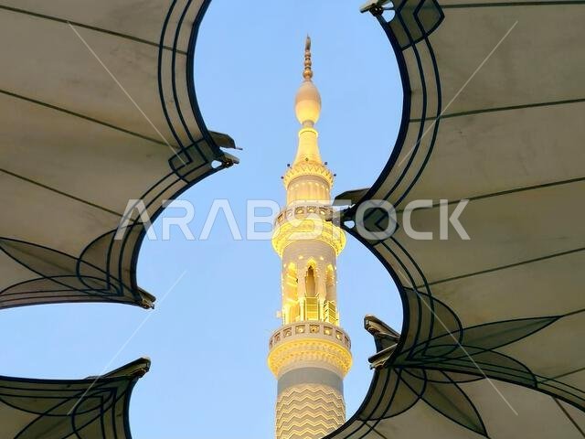 Minaret through the tents in the outside of The Prophet's Mosque or Al Masjid Al Nabawi, a major site of pilgrimage that falls under the purview of th