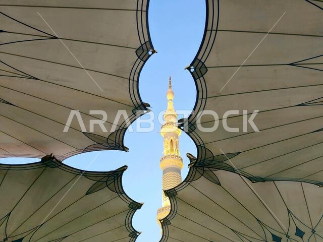 Minaret through the tents in the outside of The Prophet's Mosque or Al Masjid Al Nabawi, a major site of pilgrimage that falls under the purview of th
