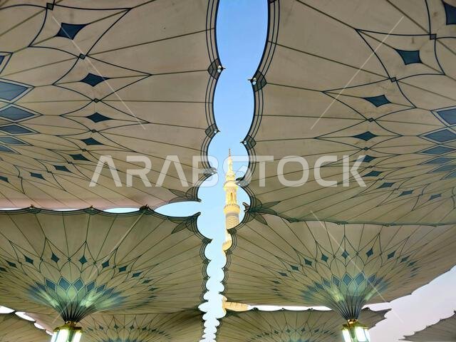 Minaret through the tents in the outside of The Prophet's Mosque or Al Masjid Al Nabawi, a major site of pilgrimage that falls under the purview of th