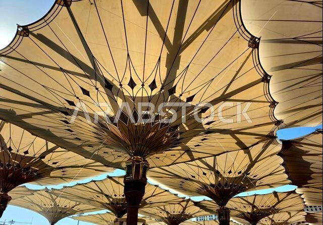 The tents at the prophet's mosque or Al Masjid Al Nabawi in Madinah at the outer courtyard to provide shade to pilgrims, a major site of pilgrimage, T