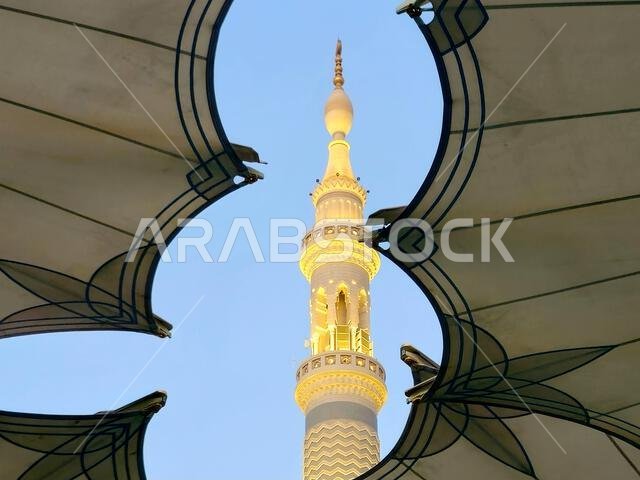 Minaret through the tents in the outside of The Prophet's Mosque or Al Masjid Al Nabawi, a major site of pilgrimage that falls under the purview of th