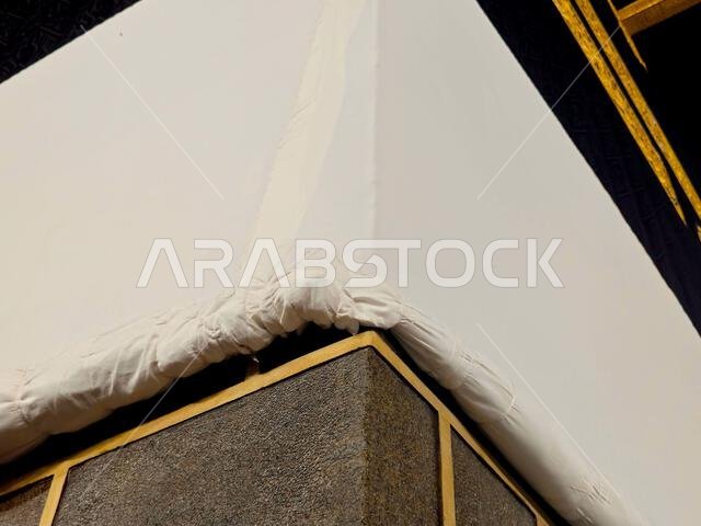 The Kaaba in Ihram clothing during pilgrimage, a stone building at the center of Islam's most important mosque and holiest site, the Masjid al-Haram,