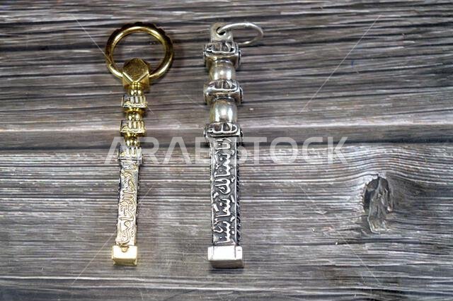 Translation of Arabic of Quran verse (Indeed, we have granted you a clear victory) and Allah word on golden gold and silver Kaaba Ka'bah keys model, m