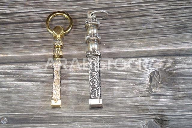 Translation of Arabic of Quran verse (Indeed, we have granted you a clear victory) and Allah word on golden gold and silver Kaaba Ka'bah keys model, m