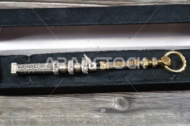 Translation of Arabic of Quran verse (Indeed, we have granted you a clear victory) and Allah word on golden gold and silver Kaaba Ka'bah keys model, m Translation of Arabic of Quran verse (Indeed, we have granted you a clear victory) and Allah word on golden gold and silver Kaaba Ka'bah keys model, m