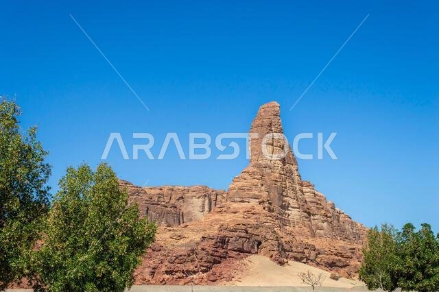 View of thumb-shaped rock mountain at Saudi Arabia Alula in a sunny day. View of thumb-shaped rock mountain at Saudi Arabia Alula in a sunny day.
