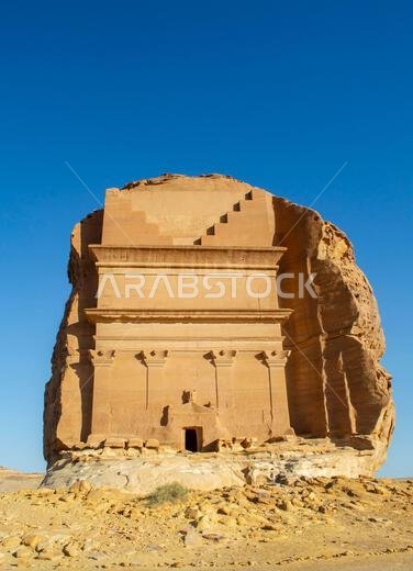 Alula, Saudi Arabia, April 4, 2024. The front view of the largest rock tomb Qaṣr al-Farīd at Hegra in a sunny day.