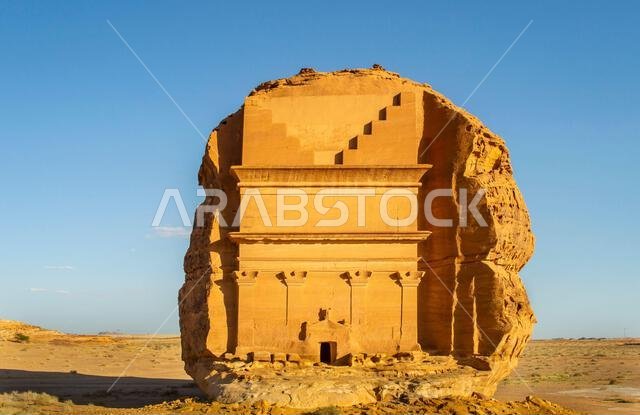 Alula, Saudi Arabia, April 4, 2024. The front view of the largest rock tomb Qaṣr al-Farīd at Hegra in a sunny day.