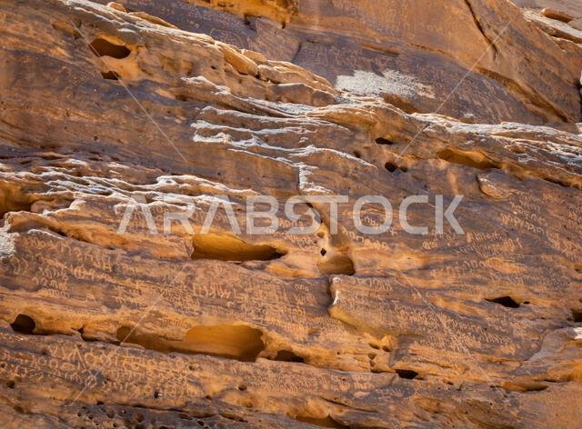 Alula, Saudi Arabia, April 4, 2024. View of the ancient Arabic scriptions on the rock at Jabal Ikmah Alula in a sunny day.
