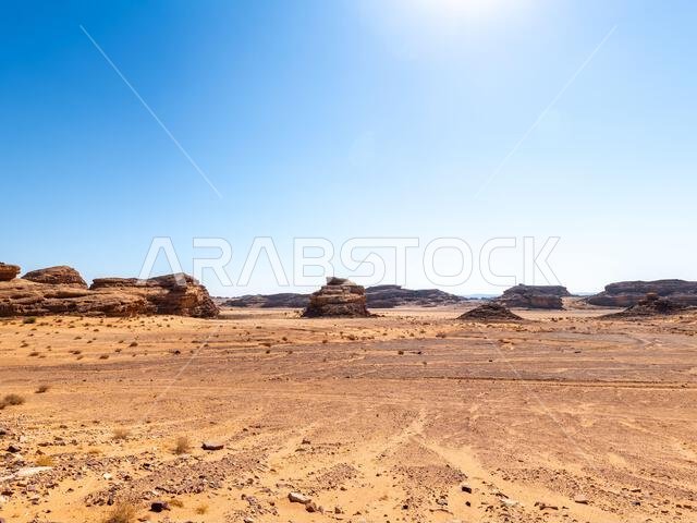 Drive on the beautiful scenic road between Riyadh and AlUla, through a landscape of sand desert, rock formations and mountains, in Saudi Arabia
