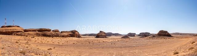 Drive on the beautiful scenic road between Riyadh and AlUla, through a landscape of sand desert, rock formations and mountains, in Saudi Arabia