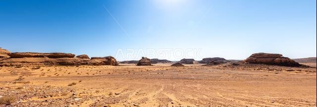 Drive on the beautiful scenic road between Riyadh and AlUla, through a landscape of sand desert, rock formations and mountains, in Saudi Arabia