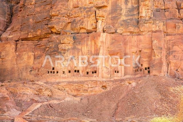 The amazing ancient ruins of tombs carved in the rock in Dadan archaeological site,  heritage of historical lost civilization, in AlUla, Saudi Arabia