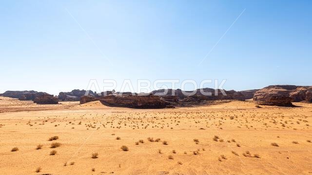 Drive on the beautiful scenic road between Riyadh and AlUla, through a landscape of sand desert, rock formations and mountains, in Saudi Arabia