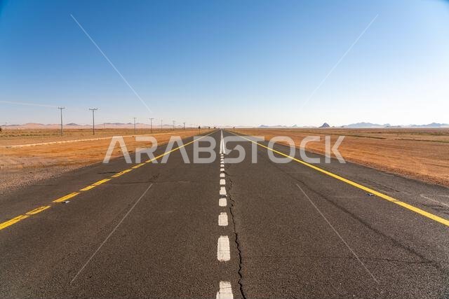 Drive on the beautiful scenic road between Riyadh and AlUla, through a landscape of sand desert, rock formations and mountains, in Saudi Arabia