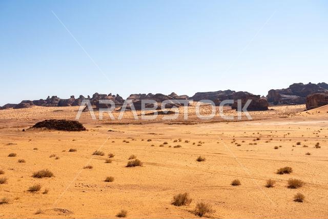 Drive on the beautiful scenic road between Riyadh and AlUla, through a landscape of sand desert, rock formations and mountains, in Saudi Arabia