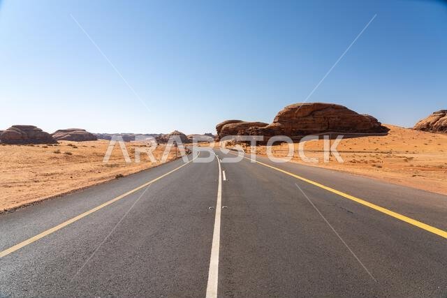 Drive on the beautiful scenic road between Riyadh and AlUla, through a landscape of sand desert, rock formations and mountains, in Saudi Arabia