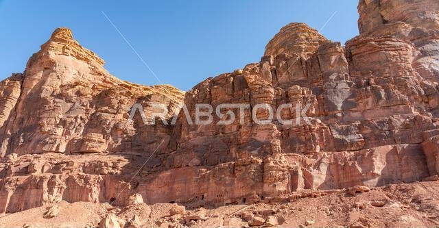 The amazing ancient ruins of the tombs carved in the rock in Dadan archaeological site,  heritage of a historical lost civilization, AlUla, Saudi Arab