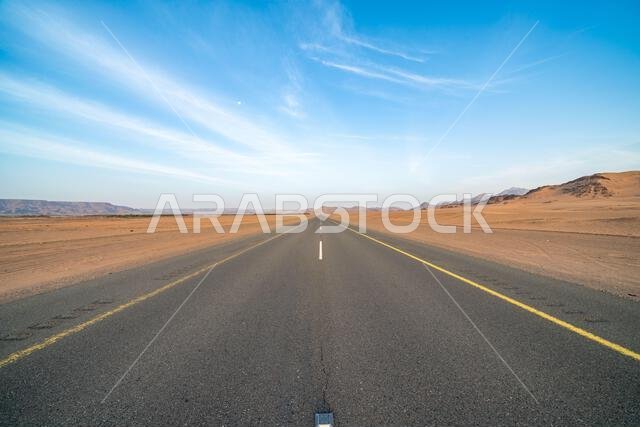 The scenic desert route from AlUla to Medina at sunrise, breathtaking panorama of Saudi Arabia with amazing sandstone rock formations The scenic desert route from AlUla to Medina at sunrise, breathtaking panorama of Saudi Arabia with amazing sandstone rock formations