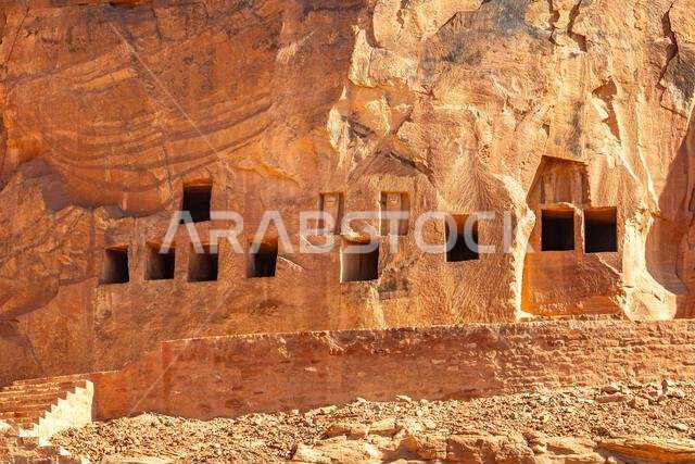 The amazing ancient ruins of tombs carved in the rock in Dadan archaeological site,  heritage of historical lost civilization, in AlUla, Saudi Arabia