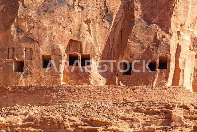 The amazing ancient ruins of tombs carved in the rock in Dadan archaeological site,  heritage of historical lost civilization, in AlUla, Saudi Arabia