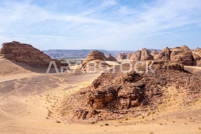 The scenic desert road between AlUla and Tabuk, Saudi Arabia, showcases amazing sandstone rock formations and a panorama with breathtaking landscape The scenic desert road between AlUla and Tabuk, Saudi Arabia, showcases amazing sandstone rock formations and a panorama with breathtaking landscape