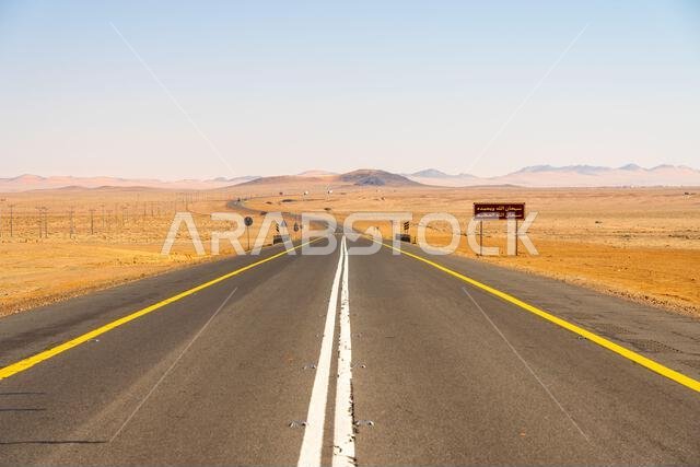 Drive on the beautiful scenic road between Riyadh and AlUla, through a landscape of sand desert, rock formations and mountains, in Saudi Arabia