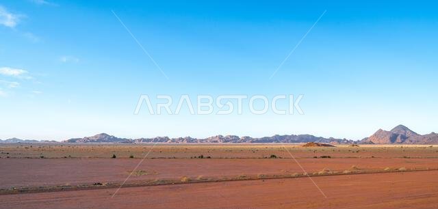 Drive on the beautiful scenic road between Riyadh and AlUla, through a landscape of sand desert, rock formations and mountains, in Saudi Arabia