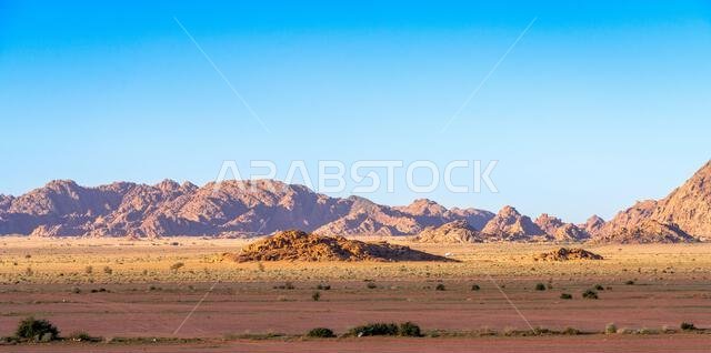 Drive on the beautiful scenic road between Riyadh and AlUla, through a landscape of sand desert, rock formations and mountains, in Saudi Arabia