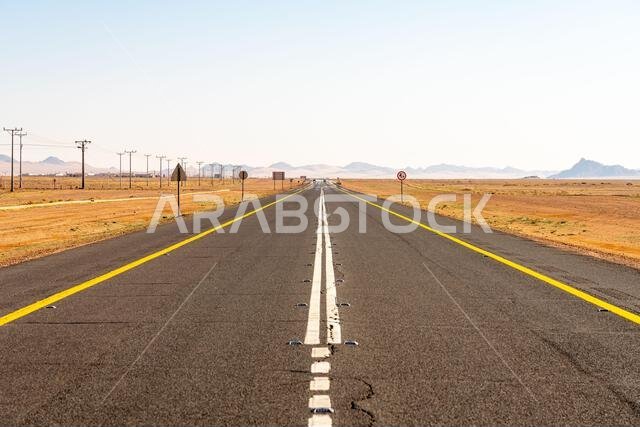 Drive on the beautiful scenic road between Riyadh and AlUla, through a landscape of sand desert, rock formations and mountains, in Saudi Arabia
