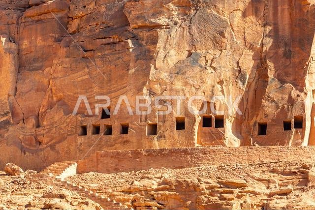 The amazing ancient ruins of tombs carved in the rock in Dadan archaeological site,  heritage of historical lost civilization, in AlUla, Saudi Arabia