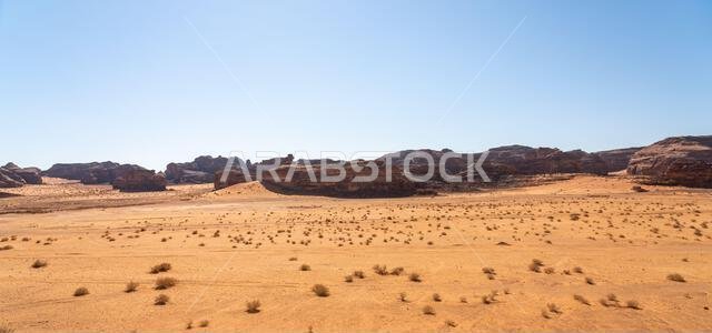 Drive on the beautiful scenic road between Riyadh and AlUla, through a landscape of sand desert, rock formations and mountains, in Saudi Arabia