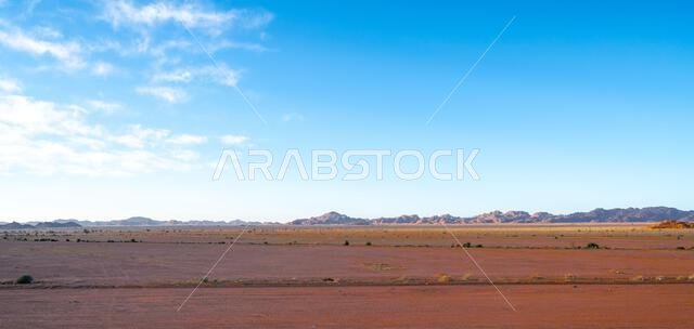 Drive on the beautiful scenic road between Riyadh and AlUla, through a landscape of sand desert, rock formations and mountains, in Saudi Arabia