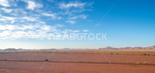 Drive on the beautiful scenic road between Riyadh and AlUla, through a landscape of sand desert, rock formations and mountains, in Saudi Arabia