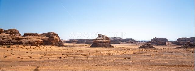 Drive on the beautiful scenic road between Riyadh and AlUla, through a landscape of sand desert, rock formations and mountains, in Saudi Arabia