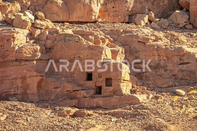 The amazing ancient ruins of tombs carved in the rock in Dadan archaeological site,  heritage of historical lost civilization, in AlUla, Saudi Arabia