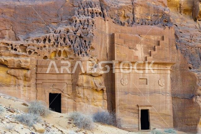 Jabal AlAhmar, carved sandstone rock at sunset, ancient tombs of Hegra, desert of AlUla, Saudi Arabia, breathtaking natural and archaeological wonder