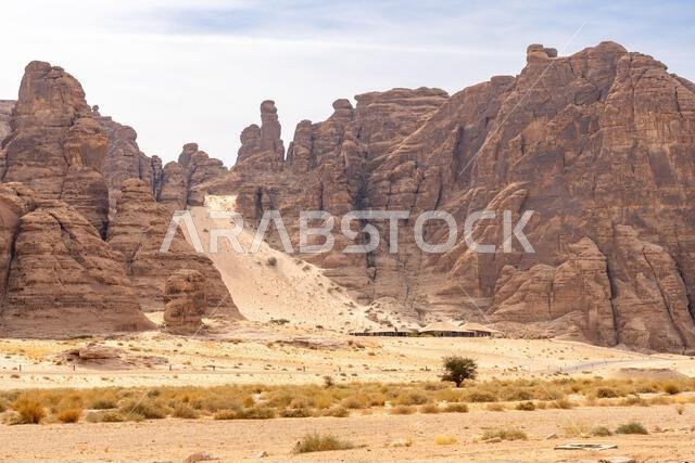 Sandstone formations of Ashar Valley provide a breathtaking backdrop for the luxurious resorts within amazing desert landscape of AlUla, Saudi Arabia