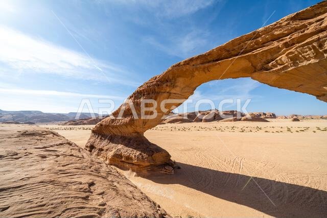 The panoramic desert landscape near AlUla, frames the amazing Rainbow Arch, amazing sandstone rock formation, wonder geological of the Saudi Arabia