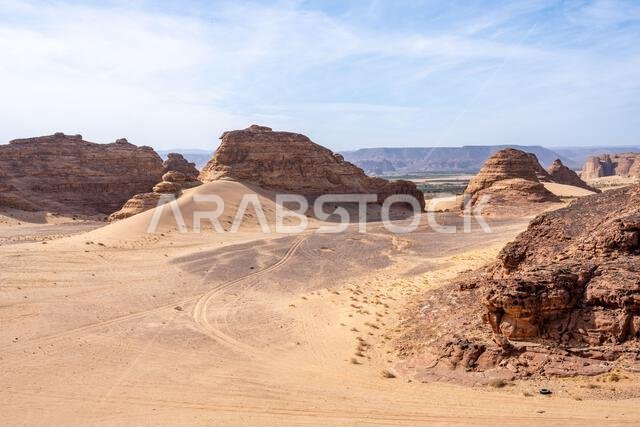 The scenic desert road between AlUla and Tabuk, Saudi Arabia, showcases amazing sandstone rock formations and a panorama with breathtaking landscape