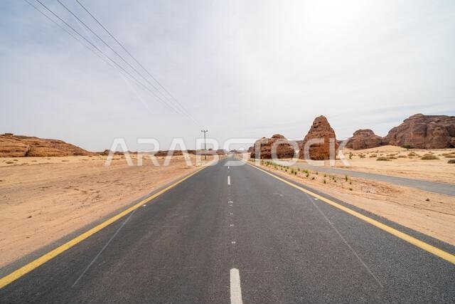 The scenic desert road between AlUla and Tabuk, Saudi Arabia, showcases amazing sandstone rock formations and a panorama with breathtaking landscape