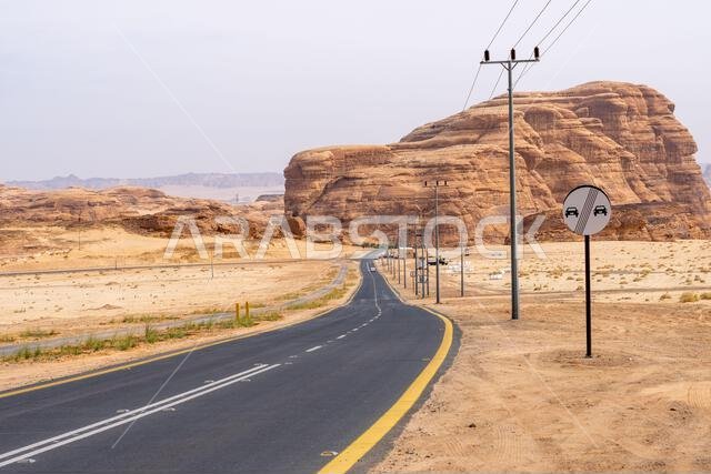 The scenic desert road between AlUla and Tabuk, Saudi Arabia, showcases amazing sandstone rock formations and a panorama with breathtaking landscape