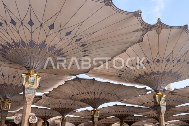Giant umbrellas of the grand King Abdullah Expansion of the Prophets Mosque in Medina, second holiest site of Islam in Saudi Arabia