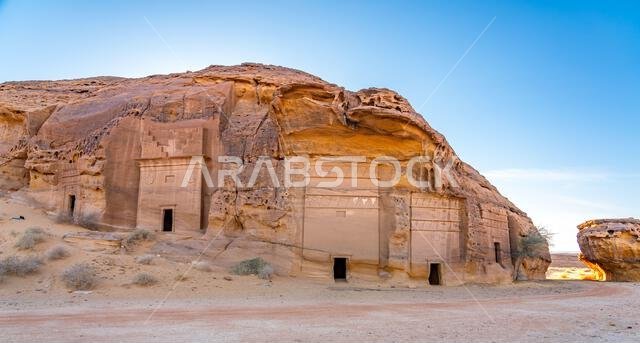 Jabal AlAhmar, carved sandstone rock at sunset, ancient tombs of Hegra, desert of AlUla, Saudi Arabia, breathtaking natural and archaeological wonder Jabal AlAhmar, carved sandstone rock at sunset, ancient tombs of Hegra, desert of AlUla, Saudi Arabia, breathtaking natural and archaeological wonder