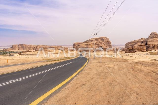 The scenic desert road between AlUla and Tabuk, Saudi Arabia, showcases amazing sandstone rock formations and a panorama with breathtaking landscape