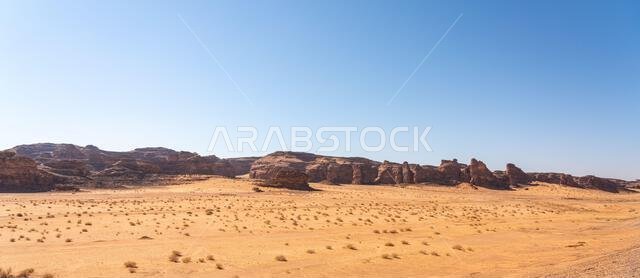 Drive on the beautiful scenic road between Riyadh and AlUla, through a landscape of sand desert, rock formations and mountains, in Saudi Arabia
