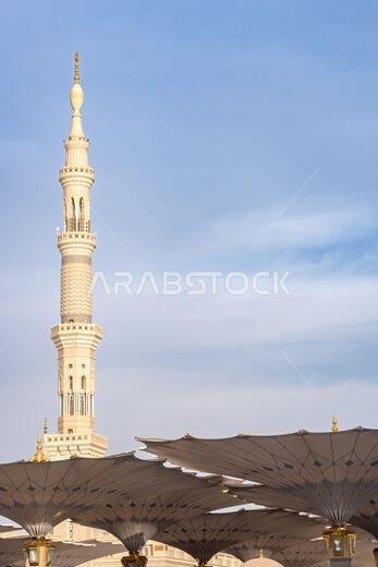Pilgrims under giant umbrellas of the grand King Abdullah Expansion of the Prophets Mosque in Medina, second holiest site of Islam in Saudi Arabia