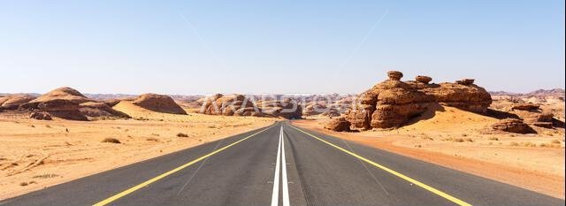 Drive on the beautiful scenic road between Riyadh and AlUla, through a landscape of sand desert, rock formations and mountains, in Saudi Arabia