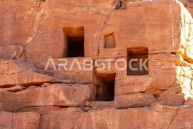 The amazing ancient ruins of tombs carved in the rock in Dadan archaeological site,  heritage of historical lost civilization, in AlUla, Saudi Arabia