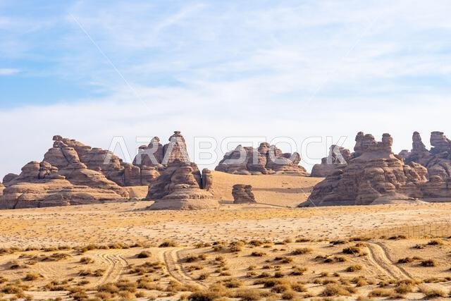 The scenic desert road between AlUla and Tabuk, Saudi Arabia, showcases amazing sandstone rock formations and a panorama with breathtaking landscape
